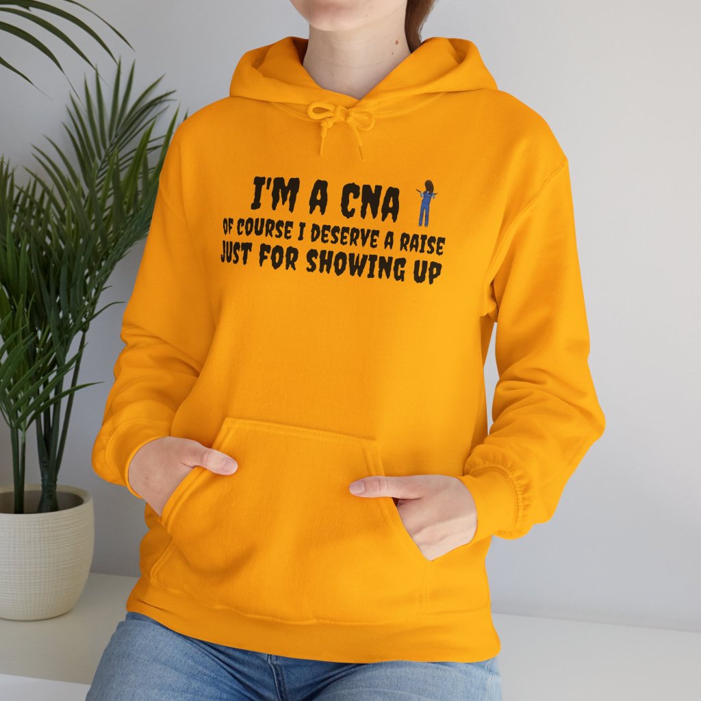 Yellow hoodie with the text "I'm a CNA of course I deserve a raise just for showing up" printed on the front, and "Life of a CNA" printed on the back. The design is bold and humorous, perfect for CNAs who want to showcase their hard work and sense of humor.